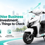 EV Franchise Business in India featuring a white Ridoji electric scooter, Ridoji logo, EV business growth chart, franchise opportunity, investment benefits, and India map.